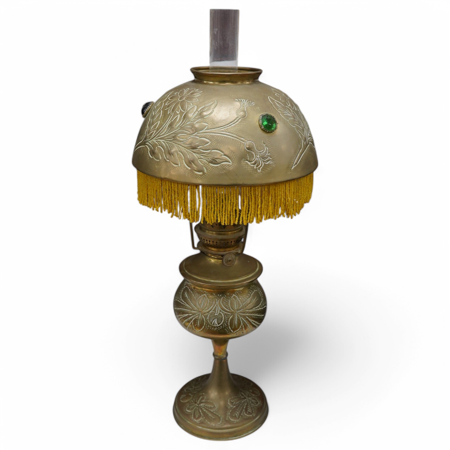 An 20th century continental brass oil lamp with decorative beaded fringed shade, 56cm high. Condition - good